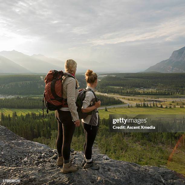 mother and daughter look across valley during hike - 16 17 girl blond hair stock pictures, royalty-free photos & images