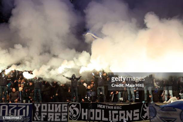 Fans of Hertha Berlin light flares in the stands during the Second Bundesliga match between Hertha BSC and Karlsruher SC at Olympiastadion on...