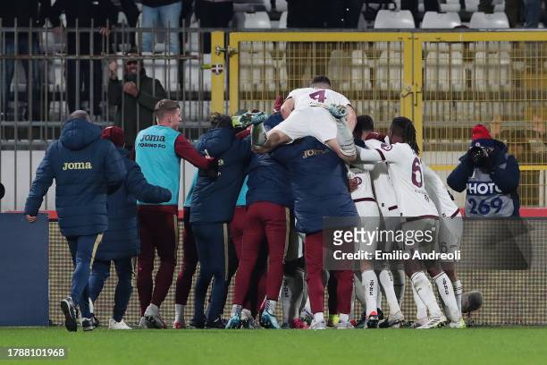 Ivan Ilic of Torino FC celebrates with teammates after scoring the team's first goal during the Serie A TIM match between AC Monza and Torino FC at...