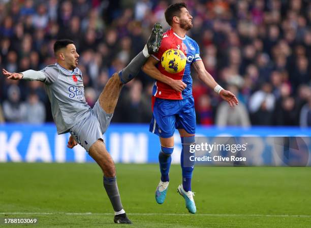 Dwight McNeil of Everton controls the ball under pressure from Joel Ward of Crystal Palace during the Premier League match between Crystal Palace and...