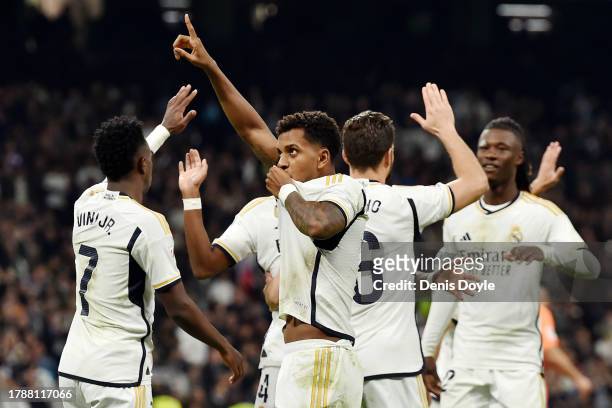 Rodrygo of Real Madrid celebrates with teammates after scoring the team's fourth goal during the LaLiga EA Sports match between Real Madrid CF and...