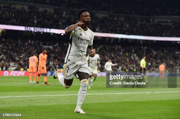 Vinicius Junior of Real Madrid celebrates after scoring the team's third goal during the LaLiga EA Sports match between Real Madrid CF and Valencia...