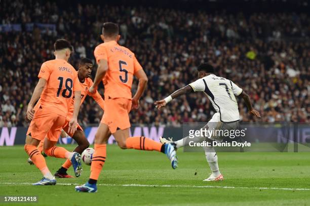 Vinicius Junior of Real Madrid scores the team's third goal during the LaLiga EA Sports match between Real Madrid CF and Valencia CF at Estadio...