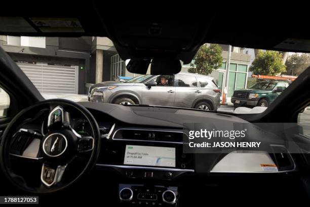 Waymo autonomous vehicle navigating a right turn onto Brady Street in San Francisco, on November 17, 2023.