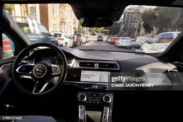 Waymo autonomous vehicle traveling down Oak Street in San Francisco, on November 17, 2023.