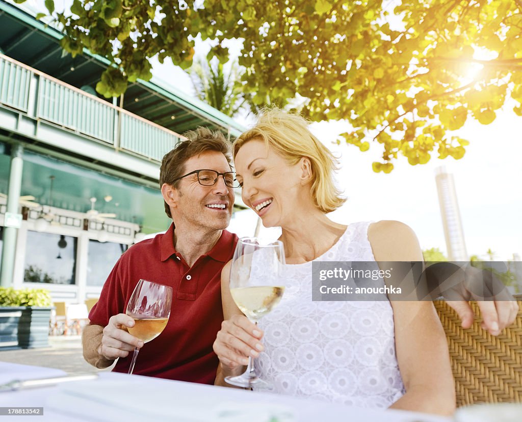 Lovely Mature Couple Enjoying Wine in a Restaurant