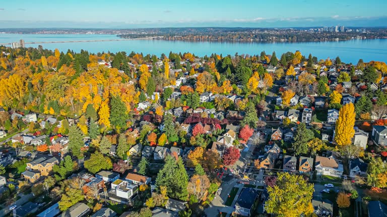 https://media.gettyimages.com/id/1788137400/video/flying-over-a-seattle-suburban-neighborhood-on-a-sunny-fall-day.jpg?b=1&s=640x640&k=20&c=gOIWm-gOBlx5Gt3I_iBt9zq9t3vhUkE0j7vtesmjeJs=