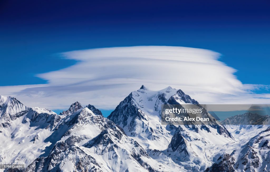 Lenticular cloud over a mountain.