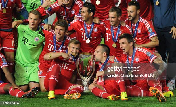 Bayern Muenchen celebrate with the trophy following the UEFA Super Cup match between Chelsea and Bayern Muenchen at Eden Stadium on August 30, 2013...