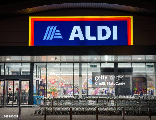 Shoppers enter a branch of the budget supermarket retailer Aldi on November 11, 2023 in Portishead, England. The German retailer founded in 1946, has...