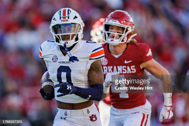 Koy Moore of the Auburn Tigers returns a punt for a touchdown in the first half during the game against the Arkansas Razorback at Donald W. Reynolds...