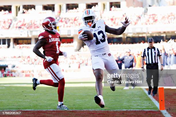 Rivaldo Fairweather of the Auburn Tigers runs the ball in for a touchdown in the first half during the game against the Arkansas Razorback at Donald...
