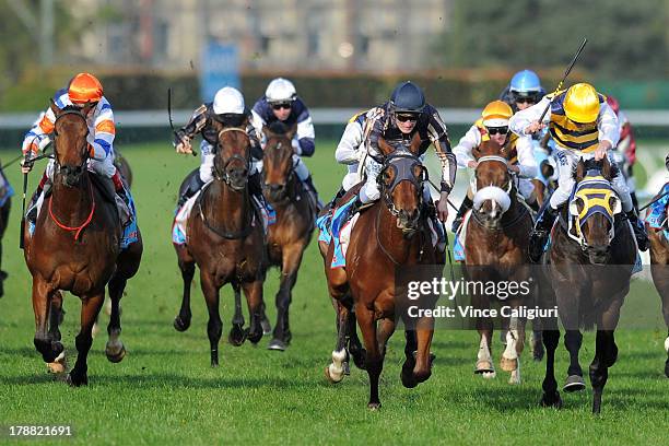 Brad Rawiller riding Ibicenco defeats Mark Zahra riding Mr O'ceirin in the Slickpix Stakes during Melbourne racing at Caulfield Racecourse on August...