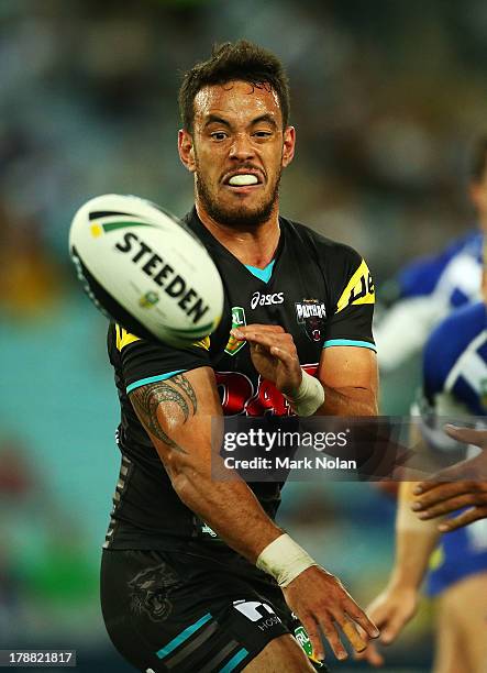Isaac John of the Panthers passes during the round 25 NRL match between the Canterbury Bulldogs and the Penrith Panthers at ANZ Stadium on August 31,...