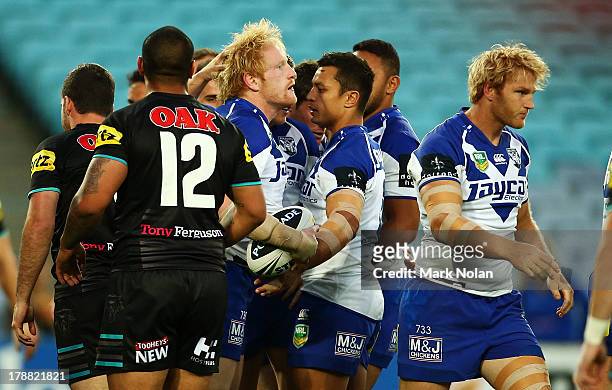 James Graham of the Bulldogs is congratulated after scoring during the round 25 NRL match between the Canterbury Bulldogs and the Penrith Panthers at...