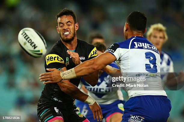 Isaac John of the Panthers passes during the round 25 NRL match between the Canterbury Bulldogs and the Penrith Panthers at ANZ Stadium on August 31,...