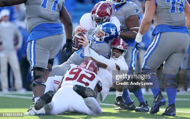 Devin Leary of the Kentucky Wildcats is sacked during the game against the Alabama Crimson Tide at Kroger Field on November 11, 2023 in Lexington,...