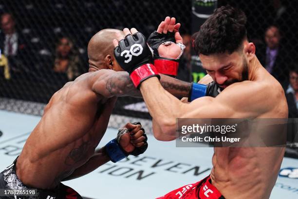 Jamall Emmers punches Dennis Buzukja in a featherweight fight during the UFC 295 event at Madison Square Garden on November 11, 2023 in New York City.
