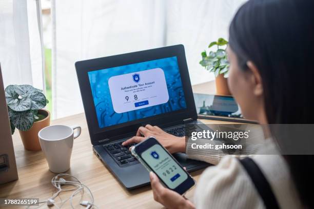 two-factor authentication (2fa) security login in securely to her laptop - privacy screen stock pictures, royalty-free photos & images