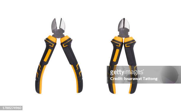 nippers or diagonal cutting pliers. wire cutter or flush nippers. side cutting pliers for electric wire. professional tools for metal construction. mechanic instrument for workshop, repairing works. - wire cut stockfoto's en -beelden