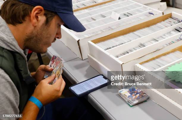 Attendees shop for trading cards at the Sports Card Expo at the International Centre on November 11, 2023 in Mississauga, Ontario, Canada.