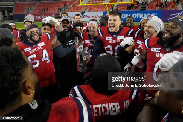 Montreal Alouettes pose with the Eastern Division trophy after defeating the Toronto Argonauts 38-17 at BMO Field on November 11, 2023 in Toronto,...