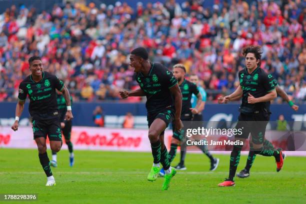 Felix Torres of Santos celebrates with teammates after scoring the team's first goal during the 17th round match between Atletico San Luis and Santos...