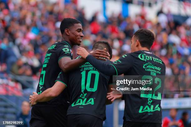 Felix Torres of Santos celebrates with teammates after scoring the team's first goal during the 17th round match between Atletico San Luis and Santos...