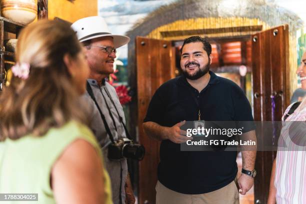 tourist guide giving a tour to seniors tourist at museum - century of progress exhibition stock pictures, royalty-free photos & images