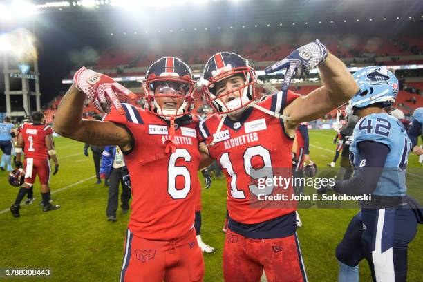 Tyson Philpot and Jake Harty of the Montreal Alouettes celebrate a win over the Toronto Argonauts during the second half of the CFL Eastern Final at...