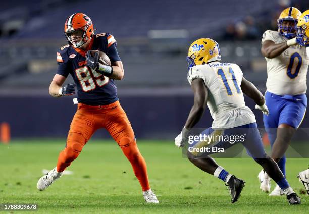 Dan Villari of the Syracuse Orange carries the ball as Bangally Kamara of the Pittsburgh Panthers defends during the second half at Yankee Stadium on...