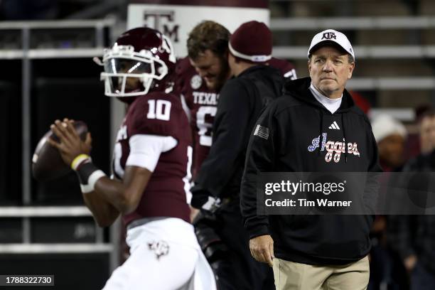 Head coach Jimbo Fisher of the Texas A&M Aggies watches players warm up before the game against the Mississippi State Bulldogs at Kyle Field on...