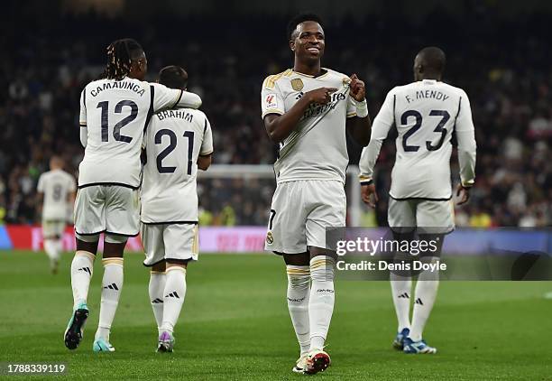 Vinicius Junior of Real Madrid celebrates after scoring the team's third goal during the LaLiga EA Sports match between Real Madrid CF and Valencia...