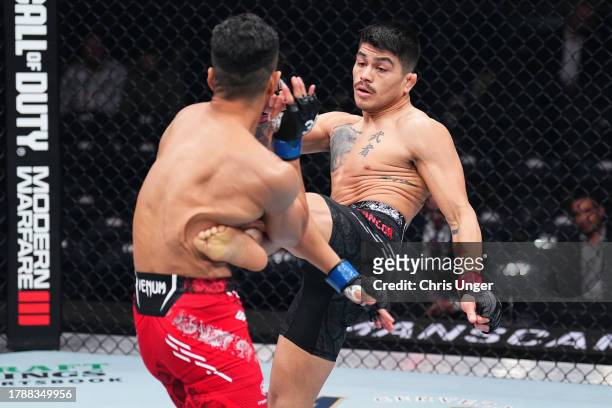 John Castaneda kicks Kyung Ho Kang of South Korea in a 138-pound catchweight fight during the UFC 295 event at Madison Square Garden on November 11,...
