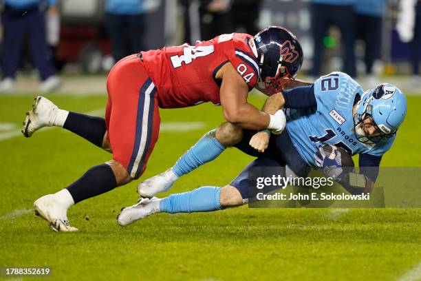 Mustafa Johnson of the Montreal Alouettes tackles Chad Kelly of the Toronto Argonauts on a rushing play during the second half of the CFL Eastern...