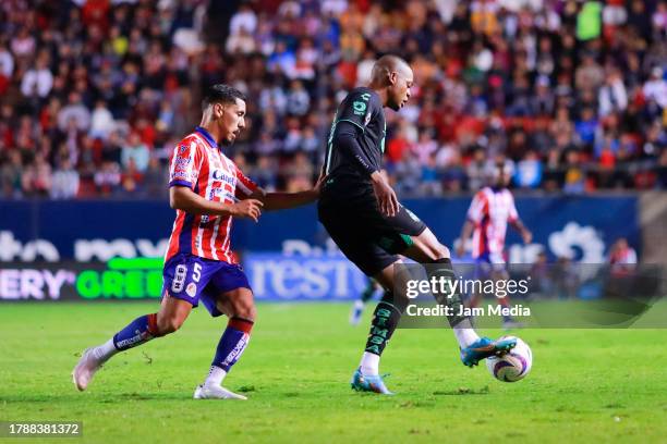 Ricardo Chavez of San Luis fights for the ball with Harold Preciado of Santos during the 17th round match between Atletico San Luis and Santos Laguna...