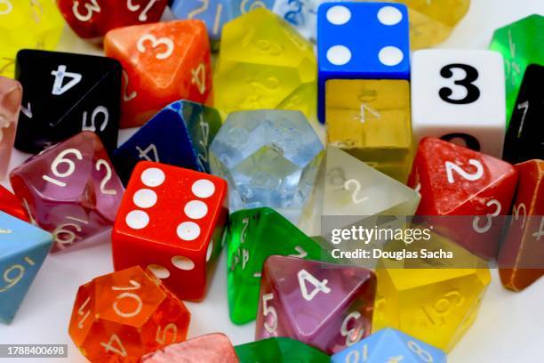 role playing strategy game dice of different shapes - dungeon stock pictures, royalty-free photos & images