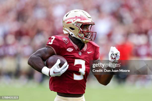 Running Back Trey Benson of the Florida State Seminoles runs during the game against the Miami Hurricanes at Bobby Bowden Field at Doak Campbell...