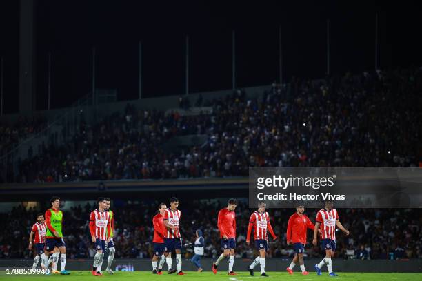 Players of Chivas leave the pitch after a defeat in the 17th round match between Pumas UNAM and Chivas as part of the Torneo Apertura 2023 Liga MX at...