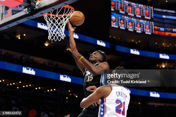 Clint Capela of the Atlanta Hawks dunks during the second half against Joel Embiid of the Philadelphia 76ers during an NBA In-Season Tournament game...