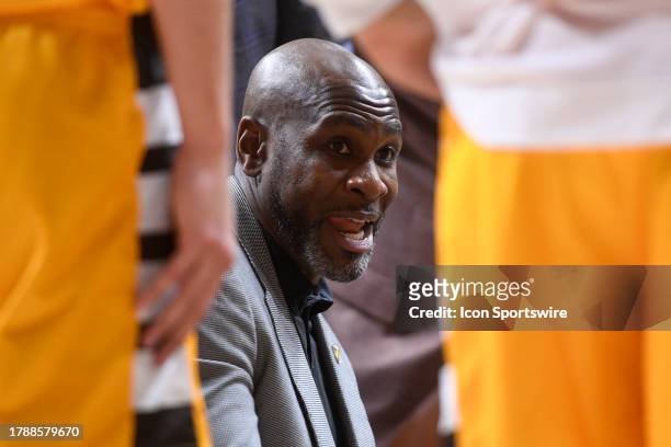 Valparaiso Beacons Head Coach Roger Powell Jr. Talks in the team huddle during a timeout in the college basketball game between the Valparaiso...