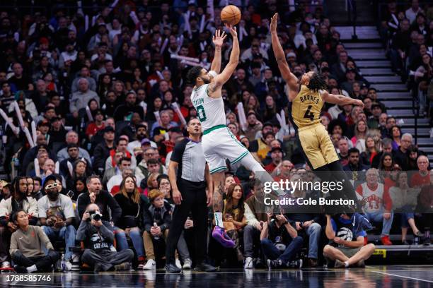 Jayson Tatum of the Boston Celtics puts up a shot over Scottie Barnes of the Toronto Raptors during the second half of their NBA In-Season Tournament...