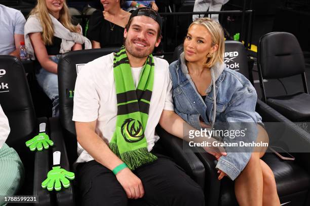 Matt Zukowski and Tammy Hembrow attend the round seven NBL match between South East Melbourne Phoenix and Melbourne United at John Cain Arena on...