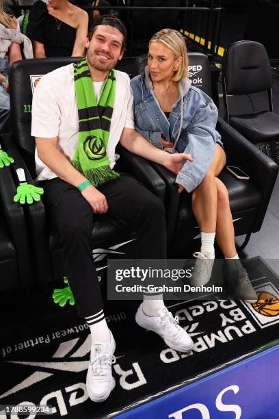 Matt Zukowski and Tammy Hembrow attend the round seven NBL match between South East Melbourne Phoenix and Melbourne United at John Cain Arena on...