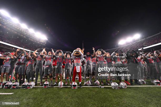 Brutus Buckeye and the Ohio State Buckeyes take part in the singing of Carmen Ohio following a 38-3 win against the Michigan State Spartans at Ohio...