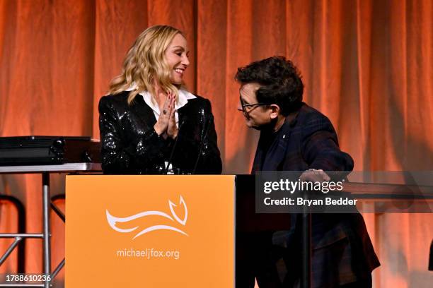 Tracy Pollan and Michael J. Fox speak onstage at 2023 A Funny Thing Happened On The Way To Cure Parkinson's at Casa Cipriani on November 11, 2023 in...