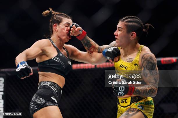 Jessica Andrade of Brazil punches Mackenzie Dern in a strawweight fight during the UFC 295 event at Madison Square Garden on November 11, 2023 in New...