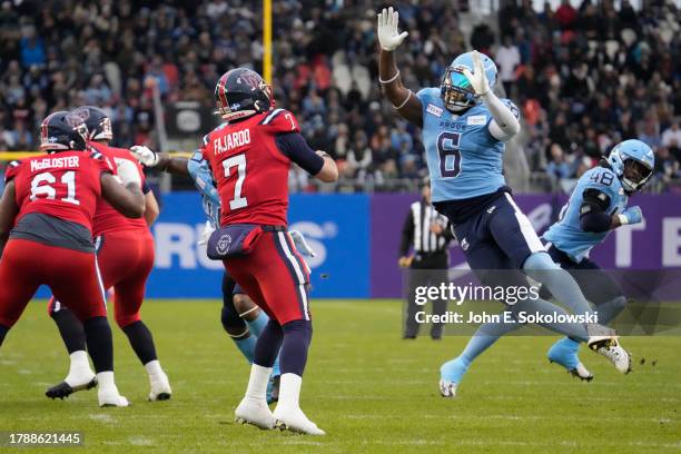 Adarius Pickett of the Toronto Argonauts pressures Cody Fajardo of the Montreal Alouettes on a pass play at BMO Field on November 11, 2023 in...