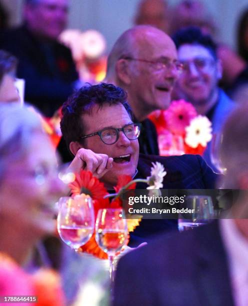 Michael J. Fox laughs during the 2023 A Funny Thing Happened On The Way To Cure Parkinson's at Casa Cipriani on November 11, 2023 in New York City.