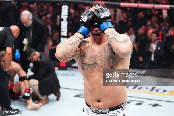 Tom Aspinall of England reacts to defeating Sergei Pavlovich of Russia by TKO in the interim UFC heavyweight championship fight during the UFC 295...